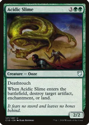 Green slime creature on brown landscape, black and white card art.