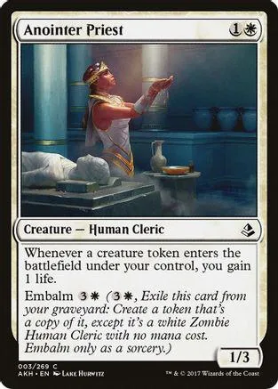 Card art: robed figure in gold and red stands in a dimly lit, ornate room.