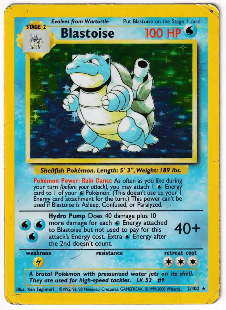 Blue and white Blastoise Pokémon card, Stage 2, 100 HP, vibrant green background.