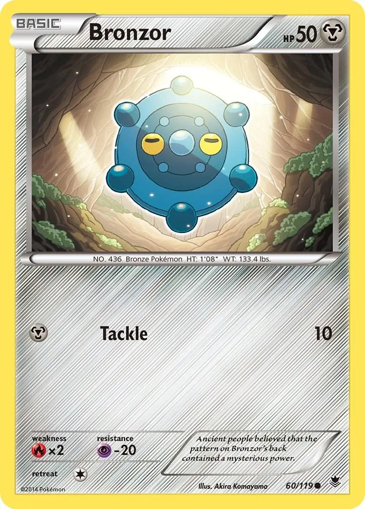 Blue and yellow Pokémon card featuring a round, blue creature in a cave setting.