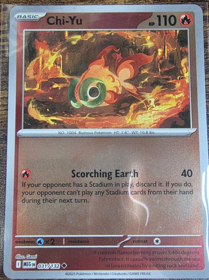 Fire-colored Pokémon card featuring a fiery creature against a burning background.