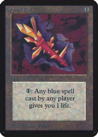 Orange and yellow crystal rod artwork on a Magic: The Gathering card.