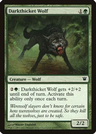 Black wolf creature on green field, aggressive stance, card art.