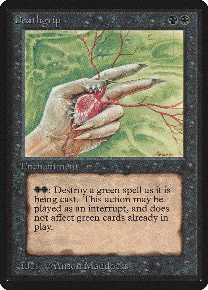 Hand holding red, thorny vines over green landscape on a card.