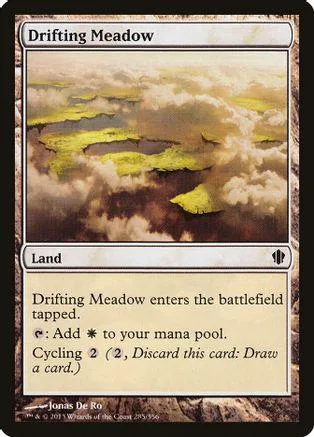 Land card art showing misty, green, rolling hills under cloudy sky.