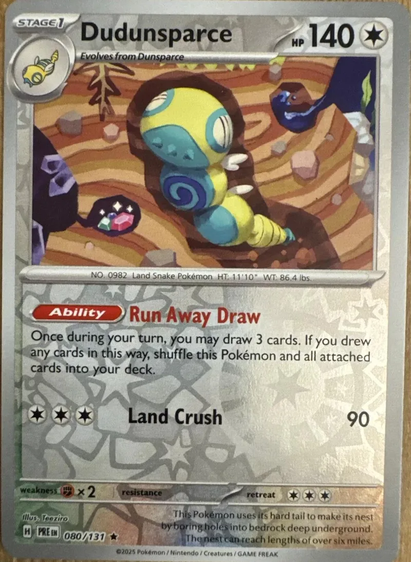 Yellow and brown Land Snake Pokémon card, showing creature in habitat.
