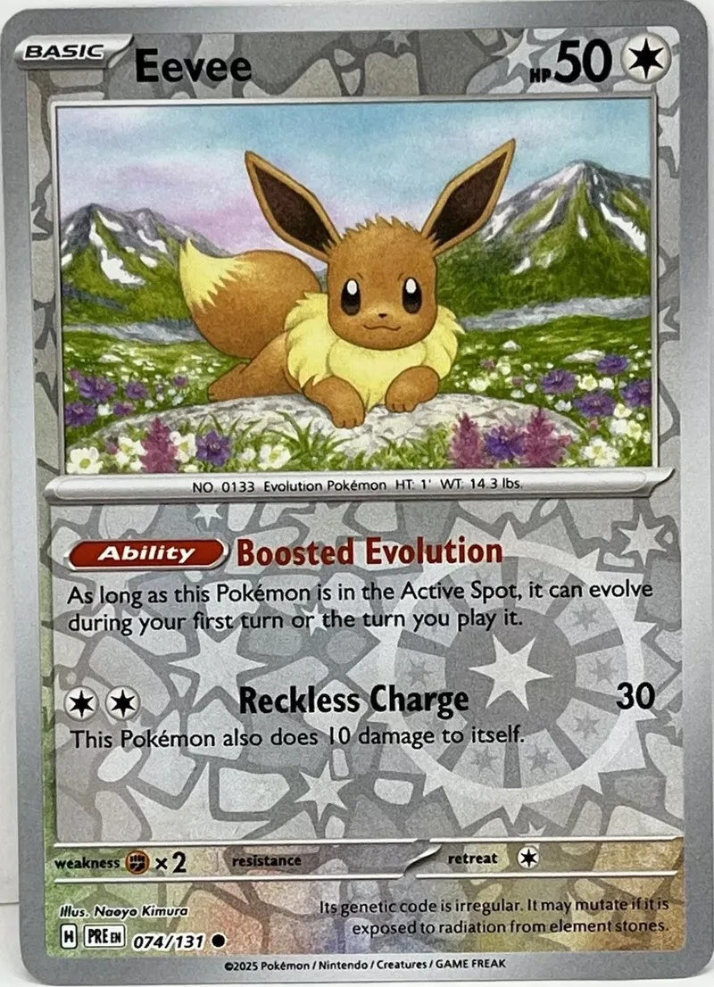 Eevee Pokémon card, brown and yellow, showing the creature in a grassy landscape.