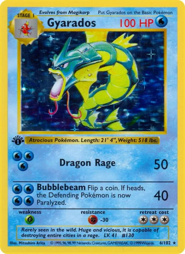 Blue and yellow Gyarados Pokémon card, 100 HP, Dragon Rage attack.
