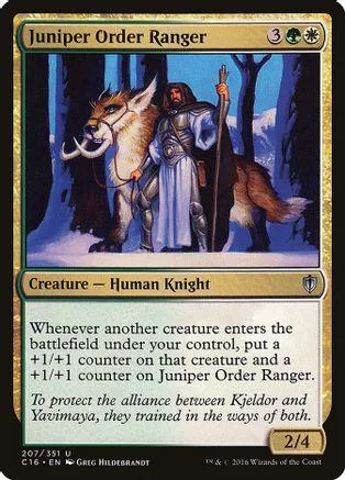 Card art shows ranger with wolf companion in a snowy forest setting.