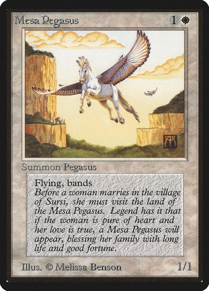 White Pegasus flying over desert landscape on a Magic: The Gathering card.