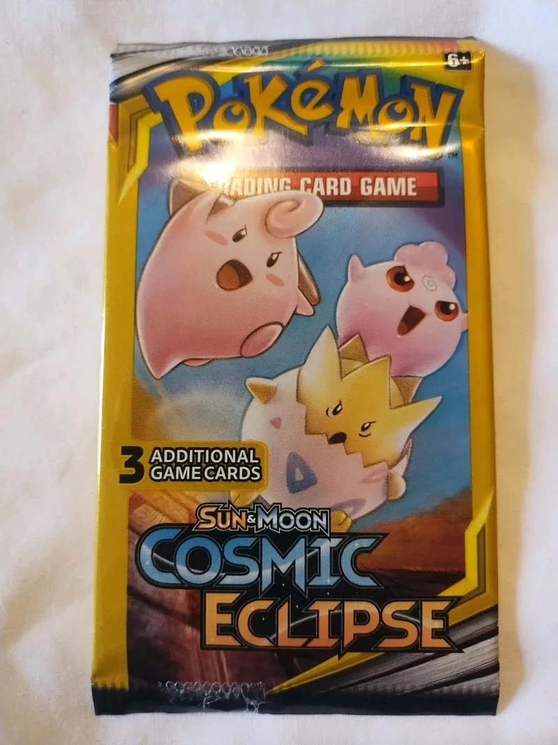 Pokémon Trading Card Game booster pack featuring pink and yellow Pokémon.