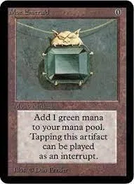 Green Mana Emerald card featuring a gold owl pendant on a dark background.