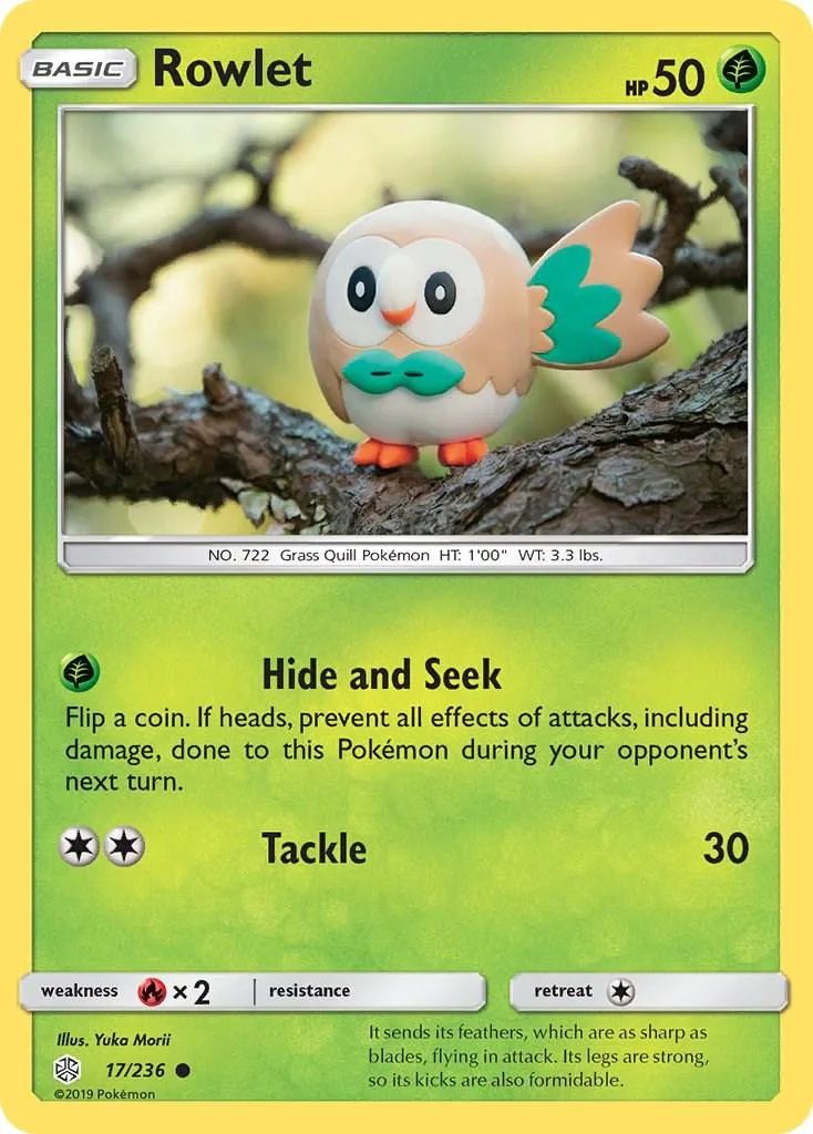 Rowlet Pokémon card, green and white, featuring a small owl on a branch.