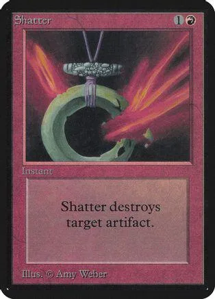 Green ring object suspended against red and black background on a card.