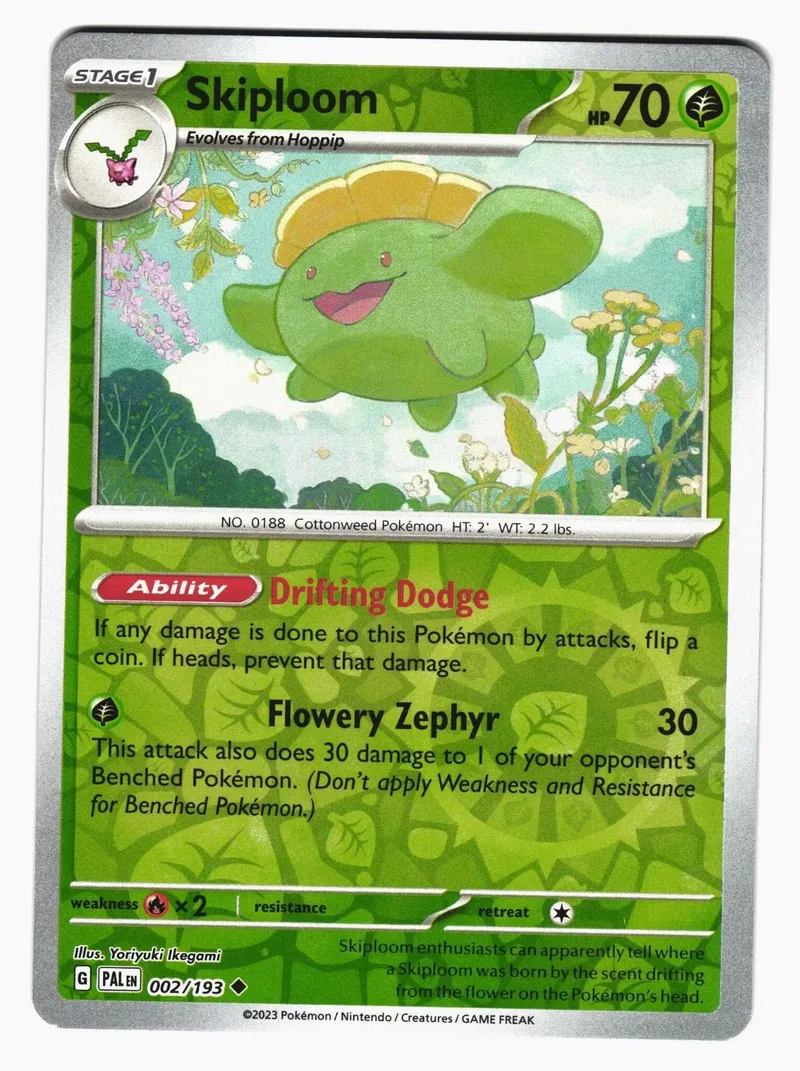 Green, smiling Pokémon card, Skiploom, with ability text visible.
