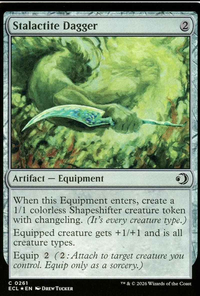 Green creature emerging from mossy rock on a card.
