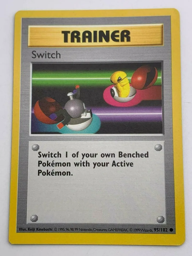 Pokémon card featuring two colorful, round Pokémon on a green and purple background.