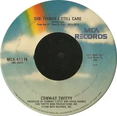 Conway Twitty – She Thinks I Still Care (Vinyl, 7")