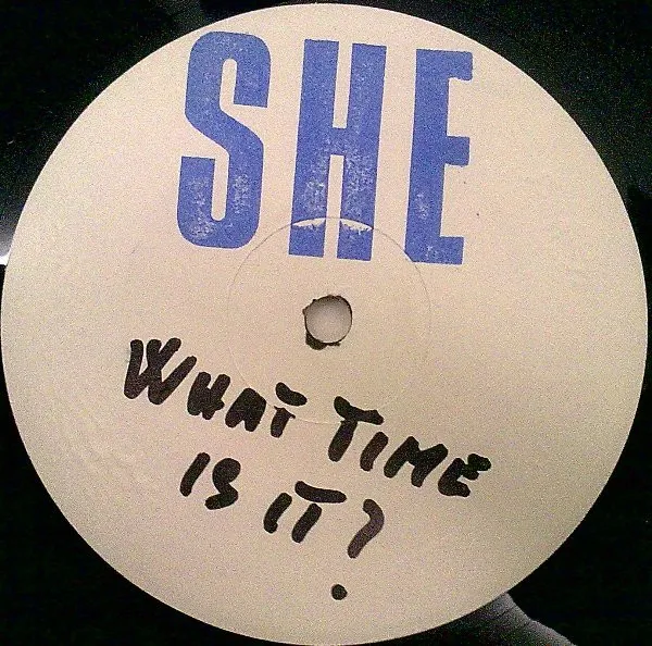 She (5) – What Time Is It?